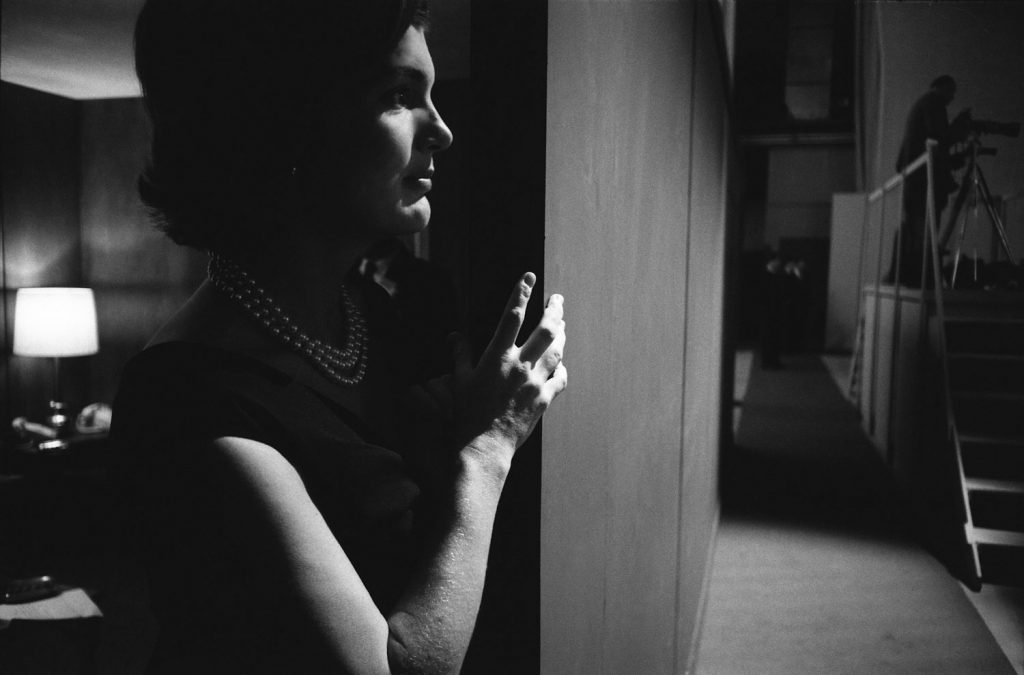 Jackie Kennedy in shadows while watching the 1960 presidential debate.